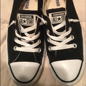 Black low top Converse Shoreline sneakers.